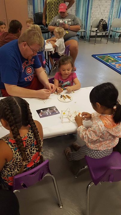 Miss Lola read some monster books and then it was time for construction with candy.   Children were ... 